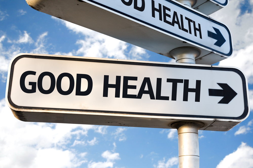 Sign that reads "good health" followed by an arrow which points onward